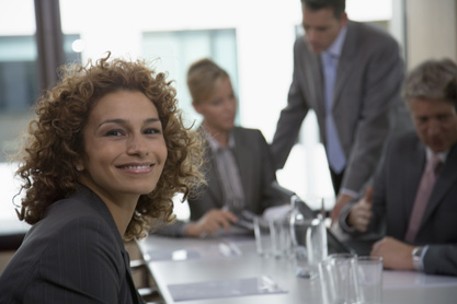 Portrait of happy businesswoman in meeting room